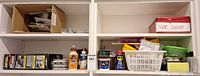 Shelf with wall hooks, adhesives, shoe shine tin, lubricant sprays, small hardware