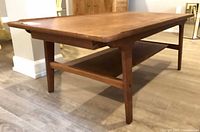 angled view showing overall table, shelf, leg style