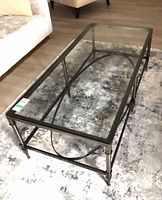 Full view of rectangular glass and metal coffee table