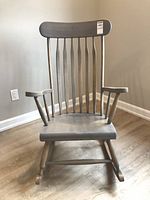 Front view of wooden Windsor spindle-back rocking chair