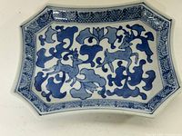 Top view of blue and white porcelain tray with deer motif