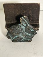 Front view showing rabbit figure and card slot