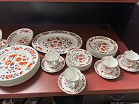 Full set showing plates, cups, saucers and platter