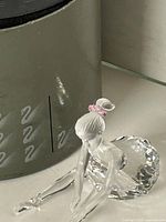 Figurine beside Swarovski cylinder box