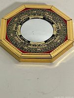 Front view showing full octagonal frame and mirror