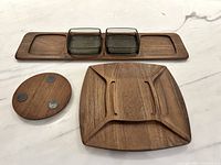 Top view of all teak trays and trivet with glass dishes in place