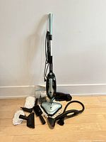 full view of steam cleaner with all accessories arranged