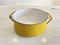 Angled view showing full exterior, color, handles and overall condition