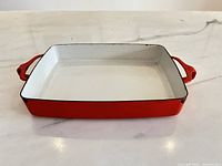 Overall view of red enamel rectangular pan
