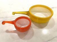 Top view of both bowls showing colours, sizes, handles