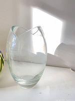 Front view showing clear glass vase height and heart-shaped rim