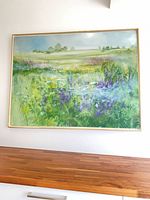 Full view of framed landscape painting on wall