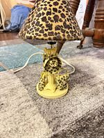 Full view of 8" night light lamp with leopard print shade and accessory-themed base