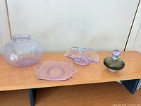 All four alexandrite glass pieces on shelf