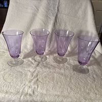 Four alexandrite water goblets front view