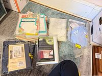 Group shot of all seven packaged window treatments on floor