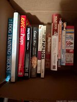 Open box showing spine titles of dog-related books