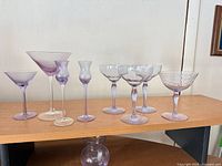 Group shot of all eight stemware pieces on shelf