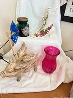 All four items together: jar candle warmer, ceramic boot, winged pig, pink vase