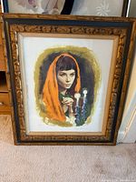 Framed portrait print showing subject and frame
