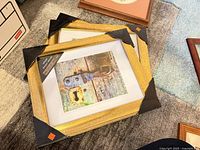 Stacked gold photo frames with protective corners