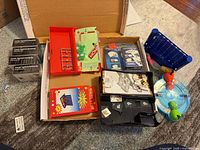 Overview of lot with travel games and CAH expansions