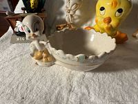 Tweety figural scalloped candy bowl with attached figure, partial view of other figurines