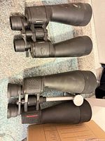 Two binocular pairs side by side showing overall size and condition