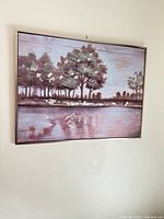 Full view of framed lakescape wall art hanging on wall