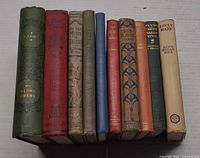 Spines of all 10 books side by side