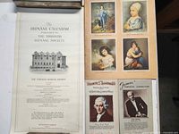 Front page of The Humane Calendar and adjacent art calendar images and conductor card calendars