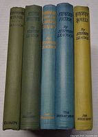 Spines of all five Stephen Leacock cloth hardcovers
