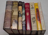 All eight books spine-up showing titles and authors