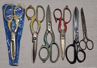 Six scissors aligned showing overall view