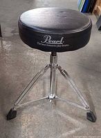 Full view of Pearl drum throne showing seat and tripod base