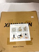 Closed carton with installation instruction sheet affixed