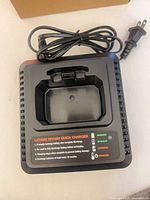 Top view of charger showing slide-in port, LED indicators and cord