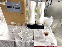 Housing, wrench, O-ring, instructions and box on table