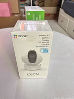 Front view of sealed EZVIZ C6CN camera box showing model and HD 1080p logo
