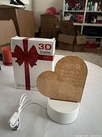 Lamp assembled with USB cable in front of 3D Creative box