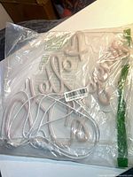 Bagged LED neon sign with USB cable visible