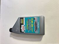 Front view of sealed Lucas 10W-40 synthetic outboard engine oil bottle