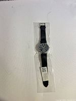 Entire wristwatch sealed in protective plastic