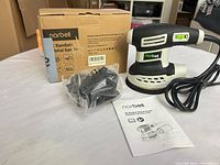 Whole lot showing sander, dust bag, manual, box