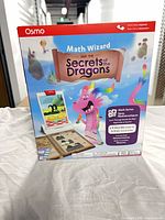 Front of Osmo Math Wizard: Secrets of the Dragons box showing graphics and title