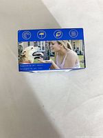 Top of box with icons and image of device in use