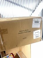 Sealed shipping carton with model marking