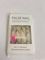 Front view of unopened 24-piece press-on nail pack showing design and packaging wear