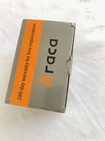 Grey and orange Araca retail box stating 200-day warranty