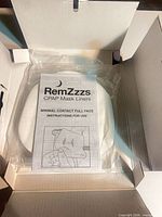 Open box showing sealed pack of liners and RemZzzs instruction leaflet
